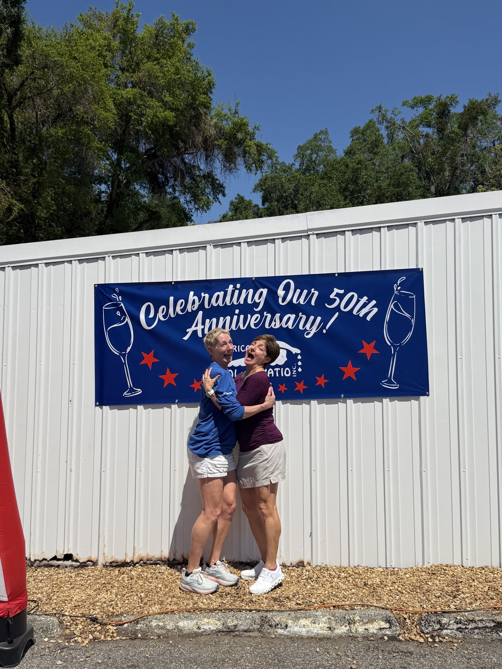 Tracey and Robin under the anniversary banner